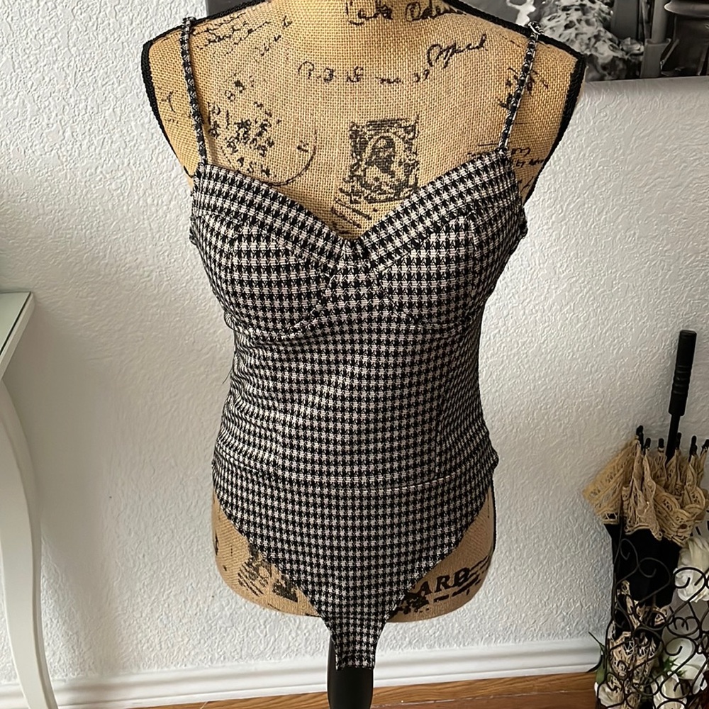 Black and tan strapped body suit
